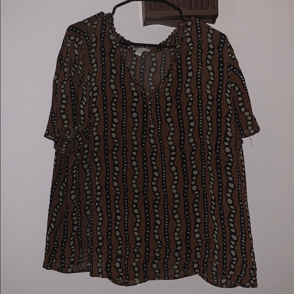 Brown blouse with dot pattern.  See through flowy